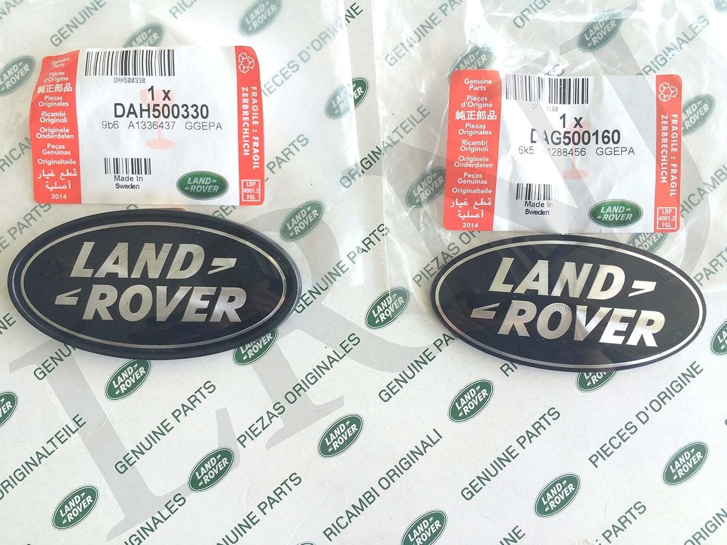 Land Rover about OVAL BADGES BLACK ON SILVER -NEW GENUINE PARTS DAG500160 + DAH500330