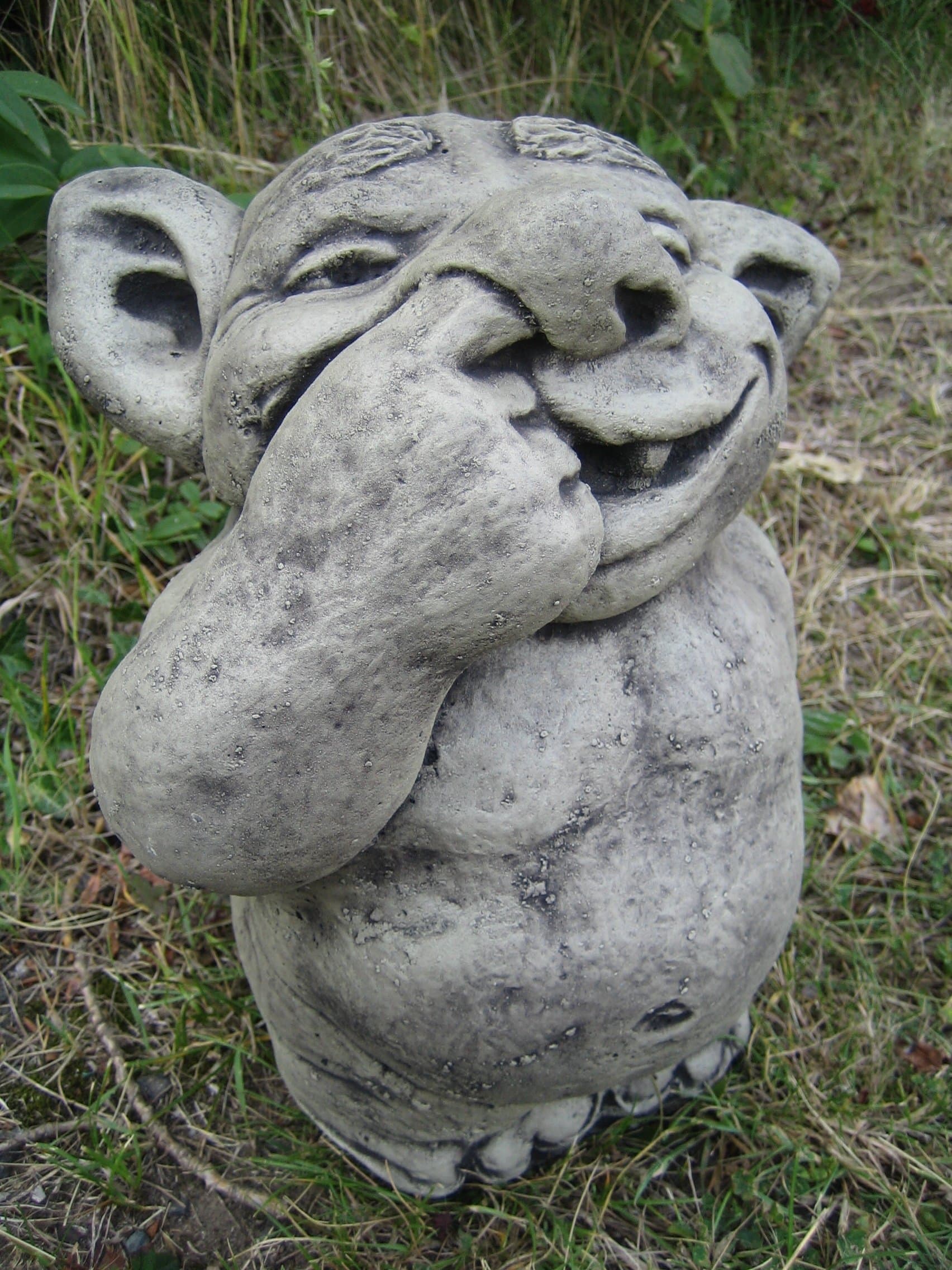 Nose picking troll stone garden ornament